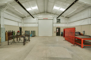 Commercial photograph of an interior of an agricultural building at a school in Newcastle, TX
