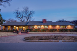 A twilight exterior real estate image of a home in Burkburnett, Texas